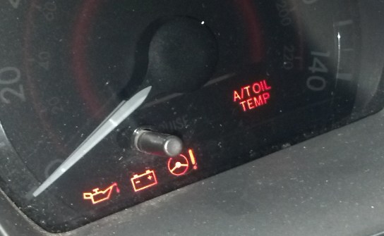 oil pressure warning light comes on and off toyota